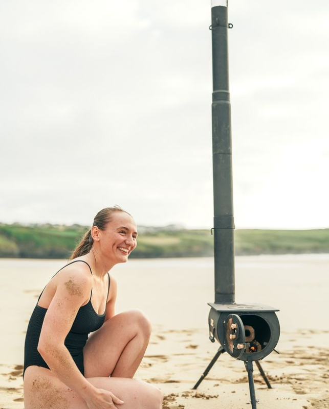 Anevay Frontier Plus Portable Wood Burning Stove set up on a beach